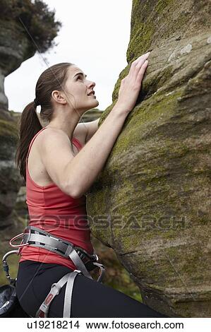 Rock climber scaling boulder View Large Photo Image Picture - Rock climber scaling boulder. Fotosearch