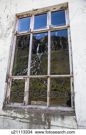 Picture - Rural waterfall reflected in window. Fotosearch