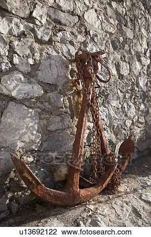 Rusted anchor against rock wall View Large Photo Image Stock Image - Rusted anchor against rock wall. Fotosearch