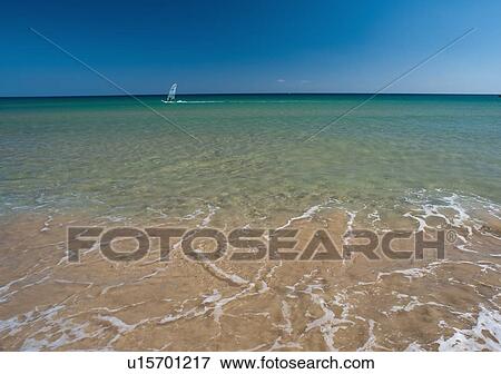 Stock Photo - Sailboat in tropical ocean. Fotosearch