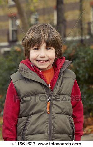 Smiling boy wearing parka outdoors View Large Photo Image Stock Image - Smiling boy wearing parka outdoors. Fotosearch