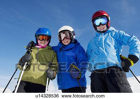 Smiling children wearing ski gear View Large Photo Image Stock Photograph - Smiling children wearing ski gear. Fotosearch