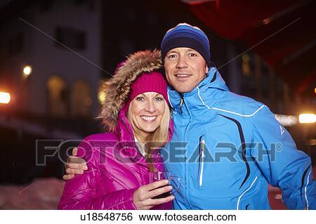 Smiling couple hugging outdoors View Large Photo Image Stock Photograph - Smiling couple hugging outdoors. Fotosearch