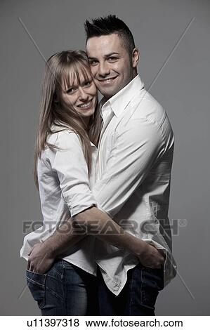 Stock Photo - Smiling couple hugging. Fotosearch