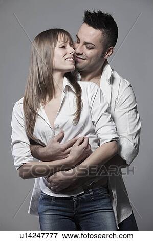 Stock Photo - Smiling couple hugging. Fotosearch
