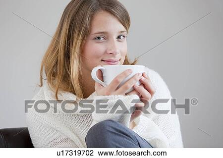 Smiling woman drinking cup of coffee View Large Photo Image Stock Image - Smiling woman drinking cup of coffee. Fotosearch