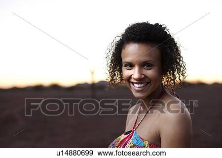 Smiling woman in desert landscape View Large Photo Image Stock Photo - Smiling woman in desert landscape. Fotosearch