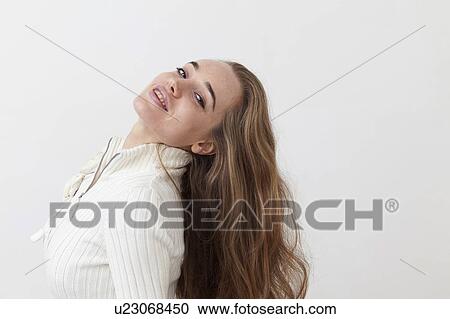 Smiling woman tossing hair View Large Photo Image Stock Image - Smiling woman tossing hair. Fotosearch