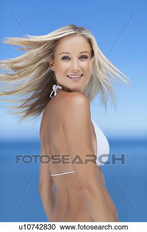Smiling woman wearing bikini outdoors View Large Photo Image Stock Image - Smiling woman wearing bikini outdoors. Fotosearch