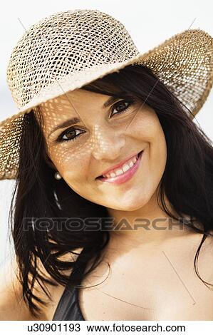 Smiling woman wearing sunhat View Large Photo Image Stock Image - Smiling woman wearing sunhat. Fotosearch