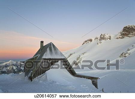 Snow piled up by house on hillside View Large Photo Image Stock Photo - Snow piled up by house on hillside. Fotosearch