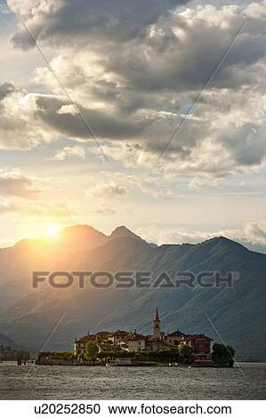 Sun shining over castle built on island View Large Photo Image Stock Image - Sun shining over castle built on island. Fotosearch