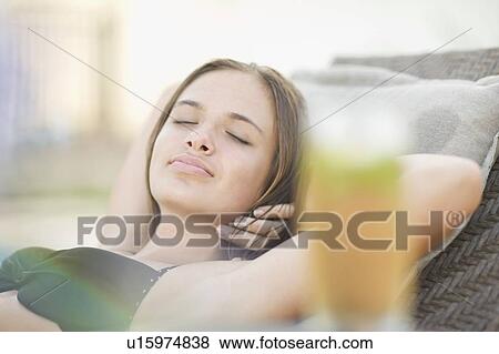 Teenage girl sleeping in lawn chair View Large Photo Image Stock Photo - Teenage girl sleeping in lawn chair. Fotosearch