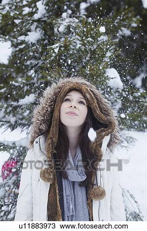 Teenage girl standing in snow View Large Photo Image Stock Image - Teenage girl standing in snow. Fotosearch