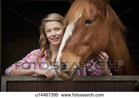 Teenage girl with horse in stables View Large Photo Image Stock Photography - Teenage girl with horse in stables. Fotosearch