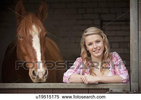 Teenage girl with horse in stables View Large Photo Image Stock Photography - Teenage girl with horse in stables. Fotosearch