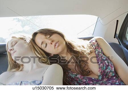 Teenage girls asleep in back seat of car View Large Photo Image Stock Photography - Teenage girls asleep in back seat of car. Fotosearch