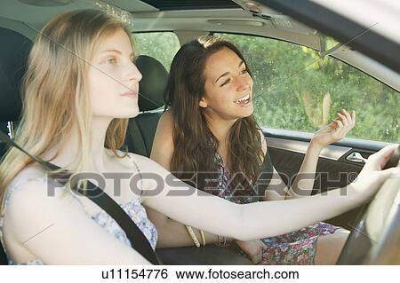 Stock Photograph - Teenage girls driving car. Fotosearch
