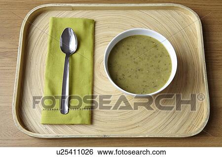 Stock Photograph - Tray with bowl of soup and spoon. Fotosearch