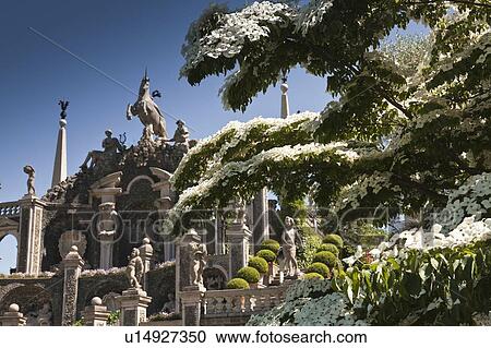 Tree by ornate statues and columns View Large Photo Image Stock Image - Tree by ornate statues and columns. Fotosearch