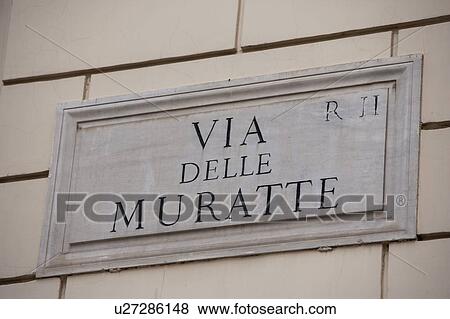 Stock Photo - Via delle Muratte sign on wall. Fotosearch