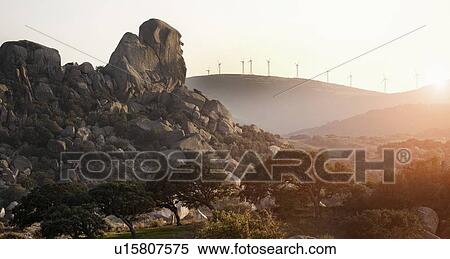 Windmills overlooking rural landscape View Large Photo Image Stock Photography - Windmills overlooking rural landscape. Fotosearch