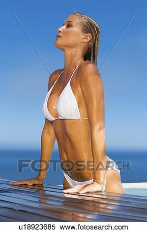 Woman climbing out of swimming pool View Large Photo Image Stock Photography - Woman climbing out of swimming pool. Fotosearch