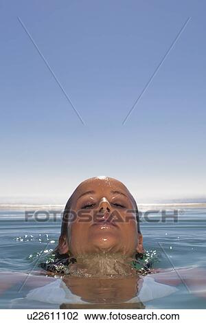 Woman emerging from swimming pool View Large Photo Image Stock Image - Woman emerging from swimming pool. Fotosearch