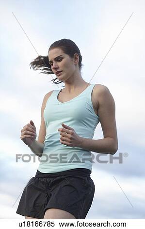 Woman running outdoors View Large Photo Image Stock Photography - Woman running outdoors. Fotosearch