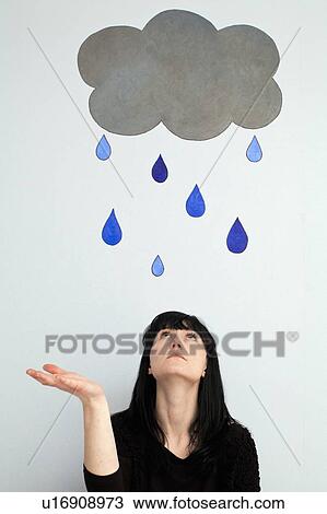 Woman standing under painted rain cloud View Large Photo Image Stock Image - Woman standing under painted rain cloud. Fotosearch