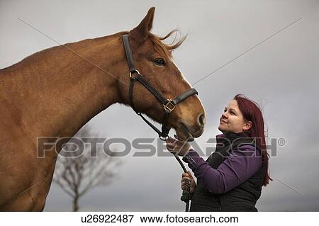 Woman walking horse outdoors View Large Photo Image Stock Photo - Woman walking horse outdoors. Fotosearch