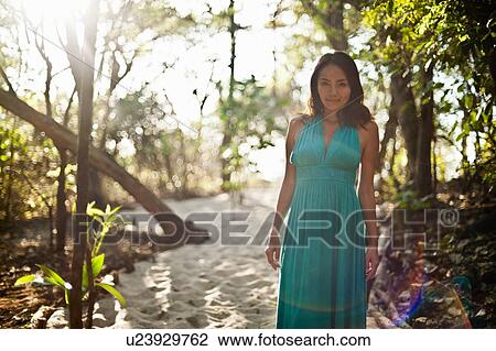Woman walking in sandy forest View Large Photo Image Stock Image - Woman walking in sandy forest. Fotosearch
