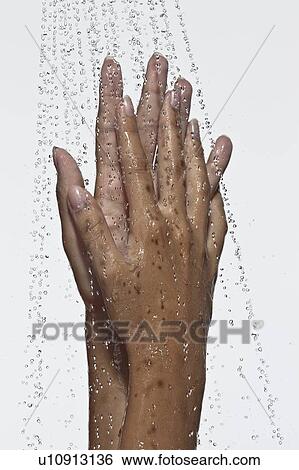 Stock Photograph - Woman washing hands in shower. Fotosearch