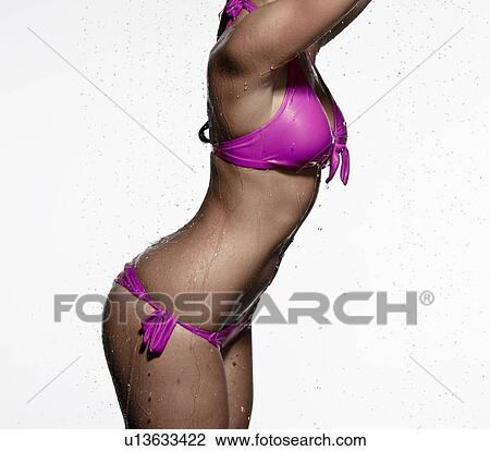 Woman wearing bikini in rain View Large Photo Image Stock Image - Woman wearing bikini in rain. Fotosearch