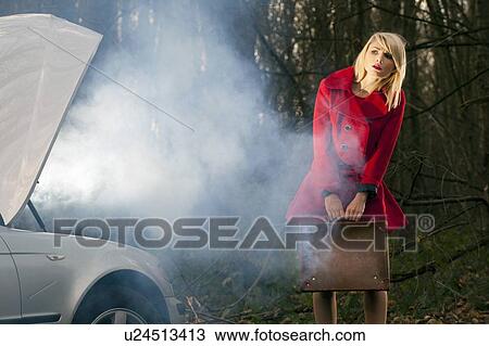 Woman with broken down car in woods View Large Photo Image Stock Image - Woman with broken down car in woods. Fotosearch