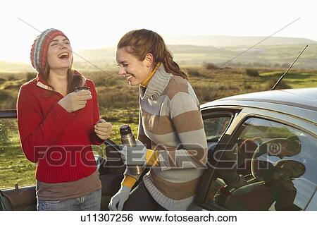 Women drinking coffee from thermos View Large Photo Image Stock Photograph - Women drinking coffee from thermos. Fotosearch