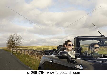 Women driving in rural landscape View Large Photo Image Picture - Women driving in rural landscape. Fotosearch