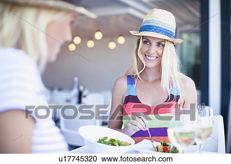 Women eating together in cafe View Large Photo Image Stock Image - Women eating together in cafe. Fotosearch