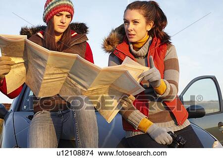 Women reading map by car View Large Photo Image Picture - Women reading map by car. Fotosearch