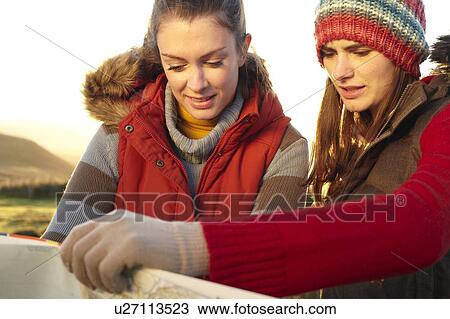 Women reading map outdoors View Large Photo Image Stock Image - Women reading map outdoors. Fotosearch