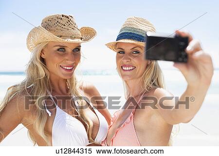 Women taking pictures of themselves View Large Photo Image Stock Photography - Women taking pictures of themselves. Fotosearch