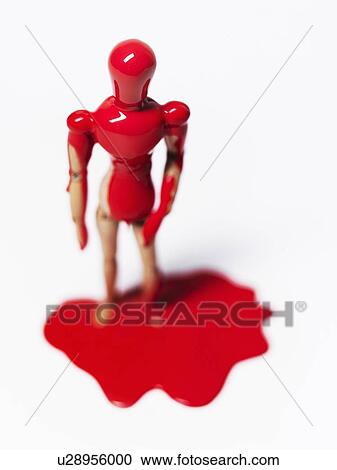 Wooden figurine splashed with paint View Large Photo Image Stock Image - Wooden figurine splashed with paint. Fotosearch