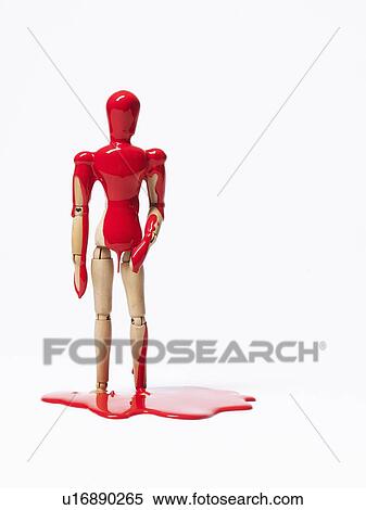 Wooden figurine splashed with paint View Large Photo Image Stock Photography - Wooden figurine splashed with paint. Fotosearch