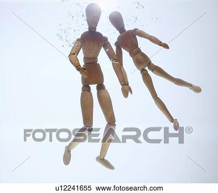 Stock Photography - Wooden figurines in water. Fotosearch