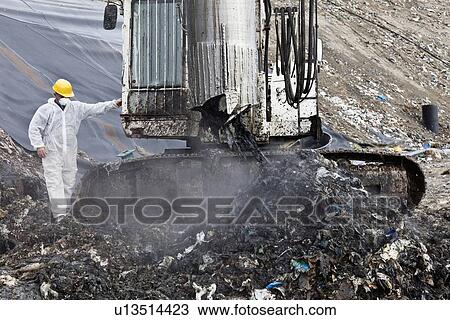 Worker at garbage collection center View Large Photo Image Stock Image - Worker at garbage collection center. Fotosearch