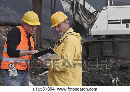 Picture - Workers at garbage collection center. Fotosearch