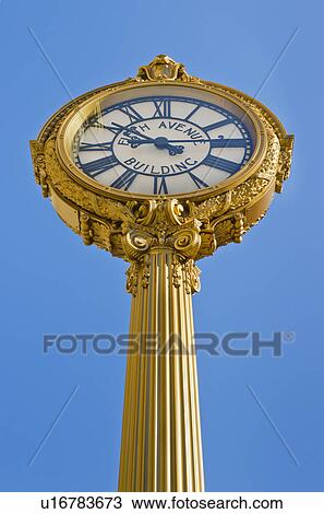 Stock Image - Antique clock against clear sky. Fotosearch