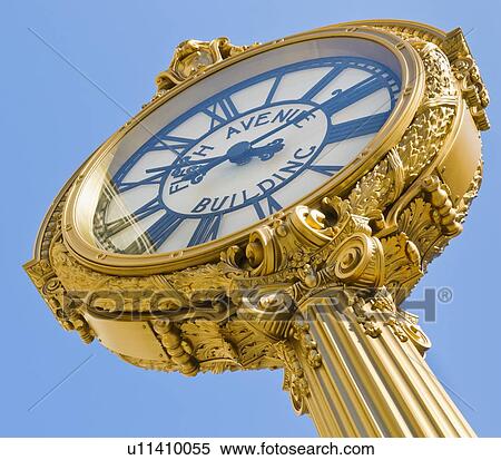 Stock Photography - Antique clock against clear sky. Fotosearch