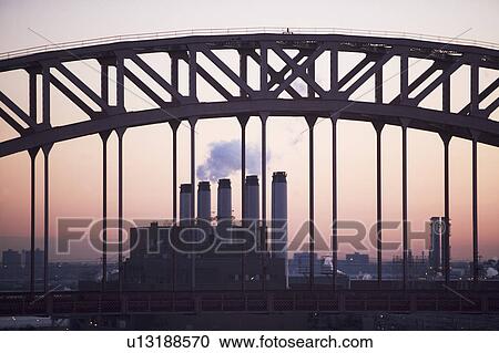 Bridge and smoke stacks at dusk View Large Photo Image Stock Image - Bridge and smoke stacks at dusk. Fotosearch