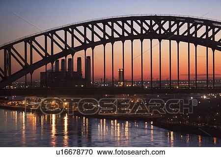 Bridge and smoke stacks at dusk View Large Photo Image Stock Image - Bridge and smoke stacks at dusk. Fotosearch